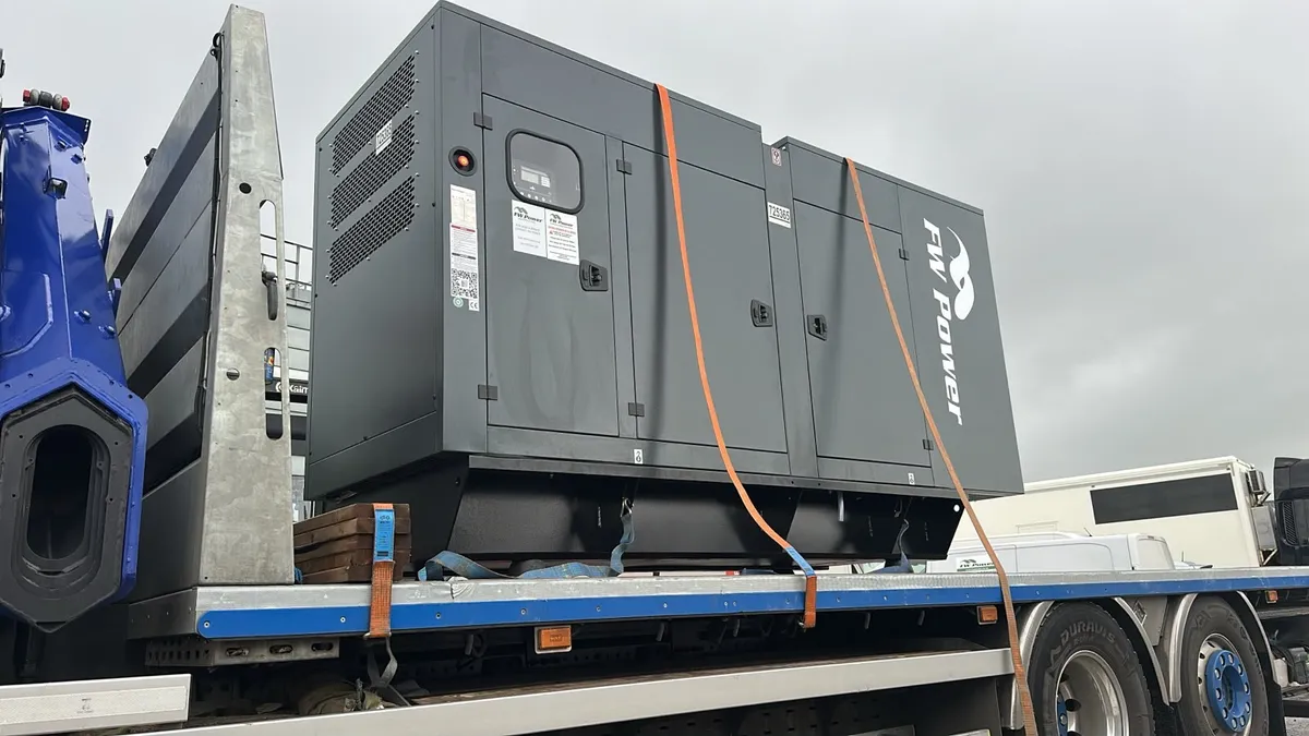 Blackwell 220 kVA canopied diesel generator strapped down for transport
