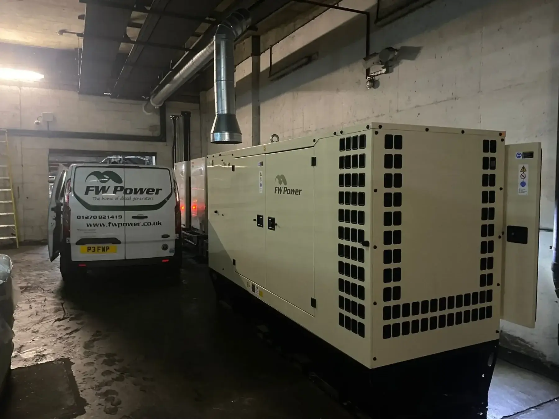 FW Power van seen from the rear beside an installed diesel generator