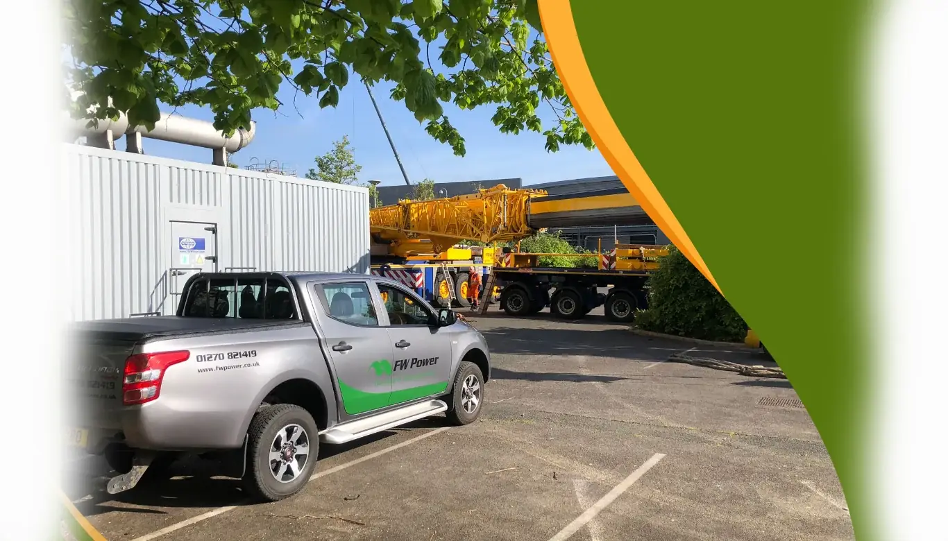 FW Power pickup truck beside a containerised generator installation and crane