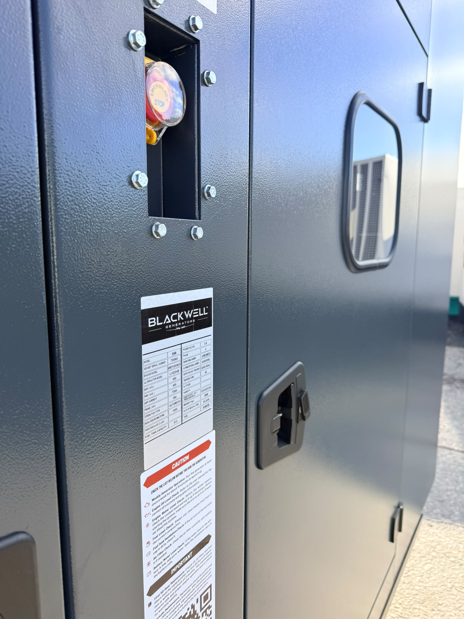 Close view of the Blackwell generator enclosure panel and emergency stop